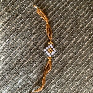 Elegant Gold and White Beaded Bracelet